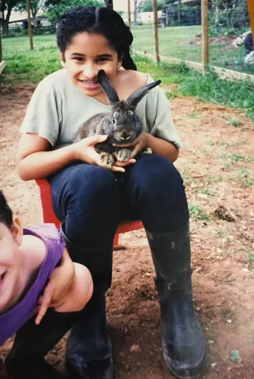 Young Sammy holding a rabbit